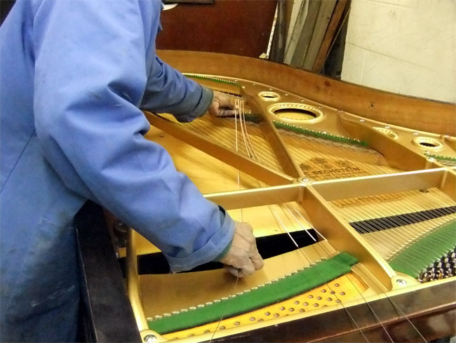 Replacing bass strings on a grand piano